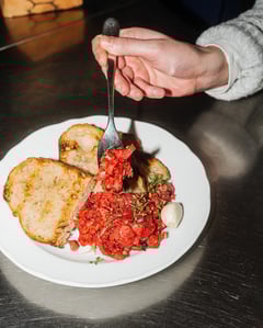 Beef tartare with toasted bread and fresh herbs